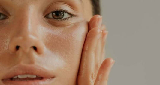 woman applying a facial mask during skincare routine